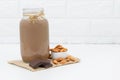 Milk Chocolate and Almonds in a glass on white background Royalty Free Stock Photo