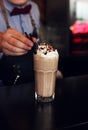 Milk chocolate cocktail with cream and multicolored sprinkles