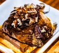 Milk chocolate and marshmallow smore covered in pecans, birch whiskey toffee sauce and cinnamon Royalty Free Stock Photo