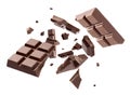 Milk chocolate pieces falling on white background Royalty Free Stock Photo