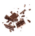 Milk chocolate pieces falling on background Royalty Free Stock Photo