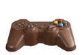 Milk chocolate in the shape of a video game controller alongside small rabbits_1 Royalty Free Stock Photo
