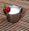 Milk cocktail in a steel mug, on a rug Royalty Free Stock Photo