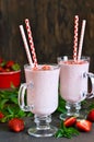 Milk cocktail with vanilla ice cream, mint and strawberries o Royalty Free Stock Photo