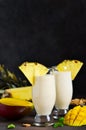 Milk cocktail with vanilla ice cream, pineapple and mango Royalty Free Stock Photo