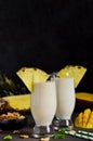 Milk cocktail with vanilla ice cream, pineapple and mango Royalty Free Stock Photo