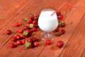 Milk cocktail on wooden old table, juicy berries. Royalty Free Stock Photo