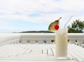 Milk coconut cocktail on table at beach cafe Royalty Free Stock Photo