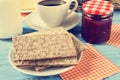 Milk, coffee, crispbread and jam, cross-processed Royalty Free Stock Photo