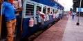 milk container hanging on milk boxes hanging out in train at indian railway station in india oct 2019