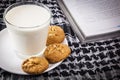 Milk, cookie and book