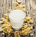Milk and cornflake on table wooden background Royalty Free Stock Photo