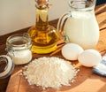 Milk egg flour oil sugar dessert ingredients pancakes baking Royalty Free Stock Photo