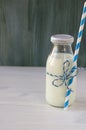 Milk in glass jars on a checkered table