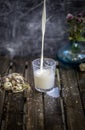 Milk in glass spilled on table with delicious kids idea