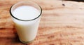 Milk glass on wooden table