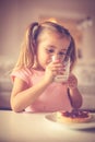 Milk is good for your boons. Little girl. Royalty Free Stock Photo