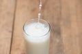 Milk. Image of Milk fall into glass. Royalty Free Stock Photo