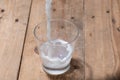 Milk. Image of Milk fall into glass. Royalty Free Stock Photo