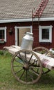 Milk jug on farm cart Royalty Free Stock Photo