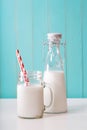 Milk in mason jar with red striped straws Royalty Free Stock Photo