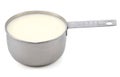 Milk in a measuring cup Royalty Free Stock Photo