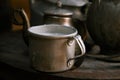 Milk mug and old teapot and kettle in a kyrgyz yurt kitchen