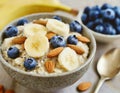 Milk oatmeal with bananas, almonds, blueberries and chia seeds. Healthy, vegetarian breakfast