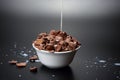 Milk pouring in a bowl of corn flakes Royalty Free Stock Photo