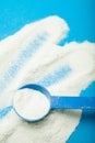 Milk powder for babies on a blue background, vertically. Substitution for breastfeeding