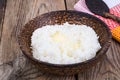 Milk rice porridge with butter in wooden bowl Royalty Free Stock Photo