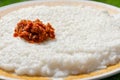 Milk rice with spicy chili sambal on a plate