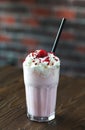 Milk shake banana and raspberries with cream