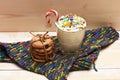 Milk shake with colorful candies and cookies