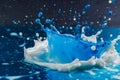 milk splash with blue food coloring Royalty Free Stock Photo