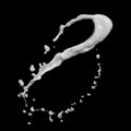 Milk splash isolated on black Royalty Free Stock Photo