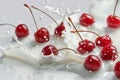 Milk splash surrounds fresh red cherries on pristine white background