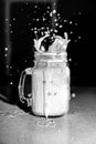 Milk Splashing out of Mason Jar