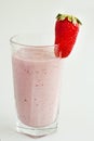 Milk strawberry smoothie made from fresh fruits on a light background. Strawberry cocktail. Royalty Free Stock Photo