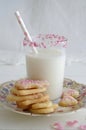Milk with sugar sprinkles and cookie hearts