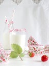 Milk with sugar sprinkles, strawberries and cupcake wrapper Royalty Free Stock Photo