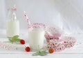 Milk with sugar sprinkles, strawberries and cupcake wrapper Royalty Free Stock Photo