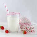 Milk with sugar sprinkles, strawberries and cupcake wrapper Royalty Free Stock Photo