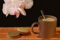 Milk tea Chocolate filled cookies Orchids Dark background