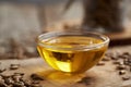 Milk thistle oil in a glass bowl with Carduus marianus seeds