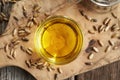 Milk thistle oil in a glass bowl with Carduus marianus seeds Royalty Free Stock Photo