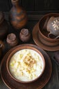 Milk traditional soup of Belarus with noodles and dough in a ceramic bowl on dark rustic background Royalty Free Stock Photo