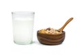 Milk in transparent glass and muesli multi fruit in wooden bowl Royalty Free Stock Photo