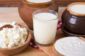 Milk in various dishes on the old wooden table. village dairy products Royalty Free Stock Photo