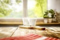 Milk on wooden kitchen tabletop and window with blurred outside garden background. Royalty Free Stock Photo